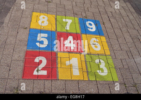 Kids outdoor game, Children's playground: Colorful hopscotch with numbers one to nine Stock Photo