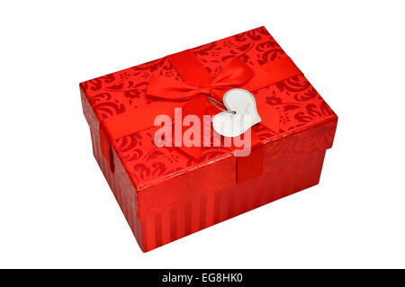 Red gift box with satin ribbon bow and heart shape card isolated Stock Photo