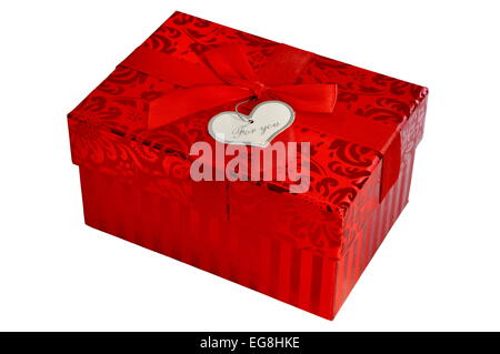 Red gift box with satin ribbon bow and heart shape card isolated Stock Photo
