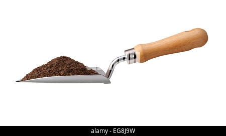 Garden Trowel with Potting Soil isolated on white. Stock Photo