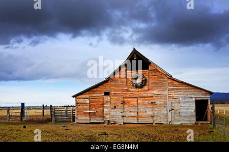 A hundred year old wooden barn in the high desert of central Oregon. Stock Photo