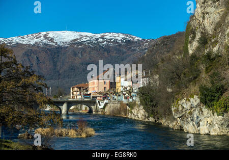 Tarascon sur Ariege and Ariege River with bridge and buildings with snowy mountains Stock Photo