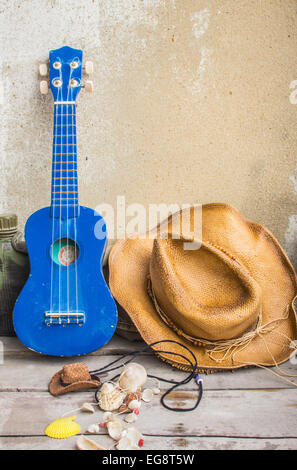 Ukulele and other devices on the table. Stock Photo