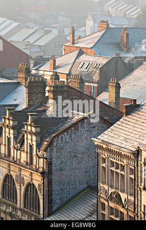 Newport City rooftop view in frozen conditions.  The paint work from an old business can be seen on the brick work in the fore. Stock Photo