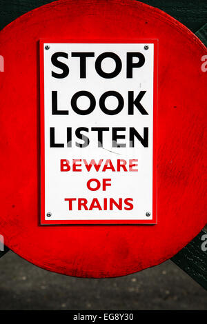 Signs 'Stop Look Listen', 'Beware of trains' and 'Warning do not ...