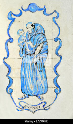 Tiles depicting a priest with a child outside St Anthony's church in Lagos, Portugal Stock Photo
