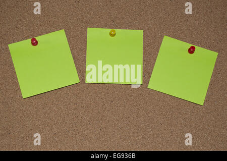 Green sticky notes on a Cork Board Stock Photo
