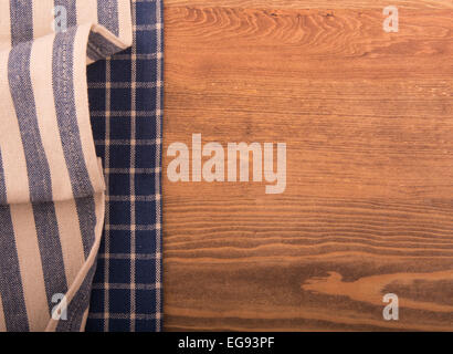 Two kitchen towels on dark wood table Stock Photo