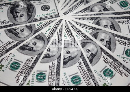 one hundred 100 dollar US bills spread in a circle Stock Photo