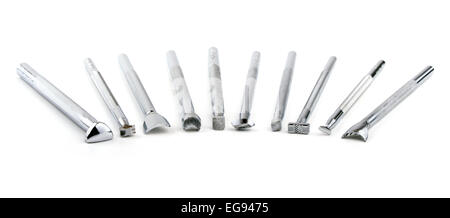 Tools for leather stamping, on white Stock Photo