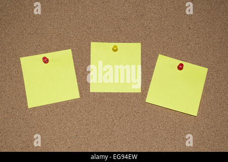 Yellow sticky Notes on a Cork Board Stock Photo