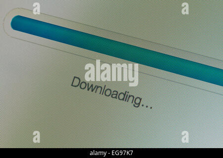 Closeup of Downloading message and progress bar on LCD computer screen Stock Photo