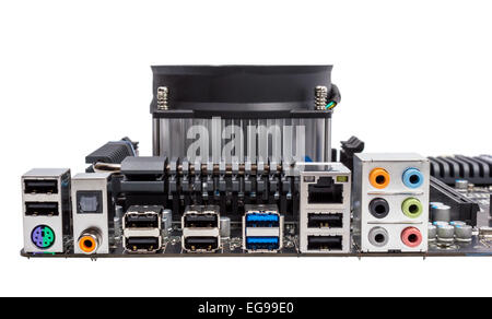 Computer motherboard isolated on white background with CPU cooler Stock Photo
