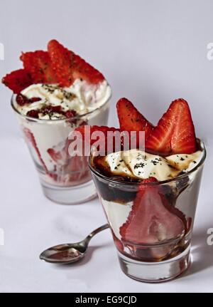 Food - strawberries with cream in a cup Stock Photo