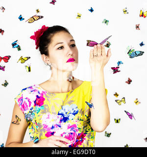 Woman holding butterflies Stock Photo