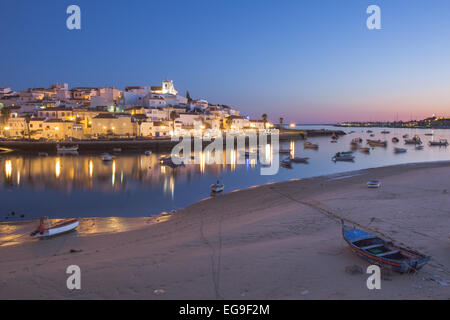 Ferragudo fishing village near Portimao illuminated at night, Lagoa, Algarve, Portugal Stock Photo