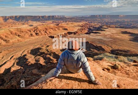 USA, Utah, Canyonlands National Park, Hiker looking at Buck Canyon Stock Photo