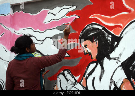 Dhaka, Bangladesh. 20th Feb, 2015. Bangladeshi fine arts students and teachers paint on a wall in front of the Shahid Minar (language movement mausoleum), in Dhaka on February 20, 2012, as part of preparations for the forthcoming Language Martyrs Day and International Mother language Day. Language Martyrs Day is marked in Bangladesh to memorialize those who died during protests on February 21, 1952 against the then Pakistani states governments' decision to name Urdu as the national language, despite East Pakistan's (Now Bangladesh) Bengali speaking majority. Credit:  Mamunur Rashid/Alamy Live  Stock Photo
