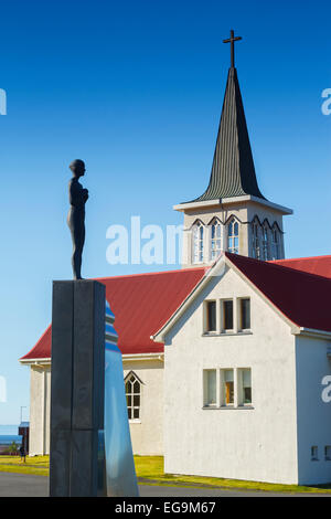 Church and statue in a village Stock Photo