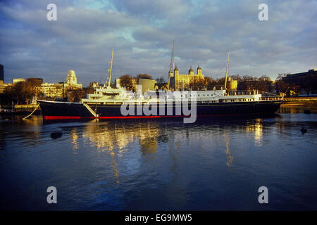 The Royal Yacht Britannia moored beside the Tower of London. England, UK. Circa 1980's Stock Photo
