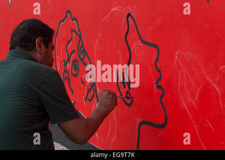 Dhaka, Bangladesh. 20th February, 2015. An artistpainting on a wall  in front of the Shaheed Minar, the Language Movement Memorial, in Dhaka as a part of preparations for Language Martyrs Day and International Mother Language Day Credit:  zakir hossain chowdhury zakir/Alamy Live News Stock Photo