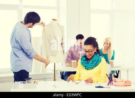 smiling fashion designers working in office Stock Photo