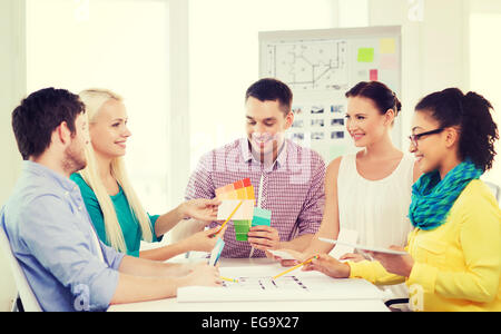 smiling interior designers working in office Stock Photo