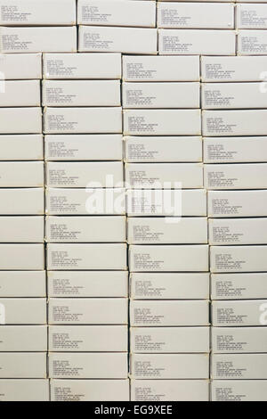 Stack of Boxes of Finished Products in Factory Ready to Ship for Export from Garment Manufacturing Industry Stock Photo