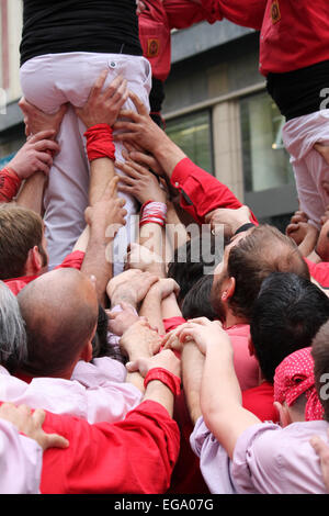 Castellers building human towers in Portal de l'Àngel, Barcelona, Catalonia, Spain Stock Photo