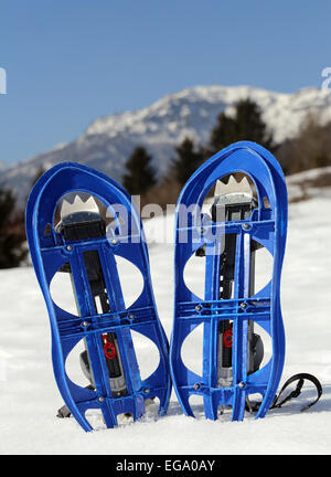 pari of orange modern snowshoes in the mountain Stock Photo - Alamy