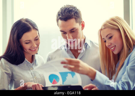 business team looking at clipboard Stock Photo