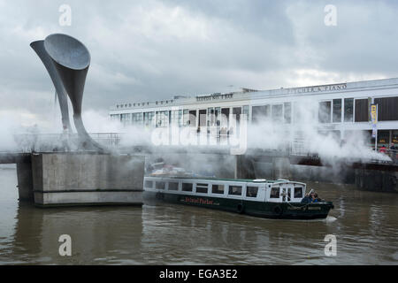 Pero's Footbridge, Harbourside, Bristol, England, UK. 20 September 2015. The bridge has been made over by Japanese artist Fujiko Nakaya who sculpts fog using high pressured water vapour. The city of Bristol is European Green Capital for 2015 and this art installation is drawing the attention of commuters and tourists to climate change and our attempts to control the weather. It is a busy footbridge with tourists taking photos of it, commuters passing over on foot and by bike and many boats passing underneath. All are emerging wet from the vapour. CarolynEaton/Alamy News Live