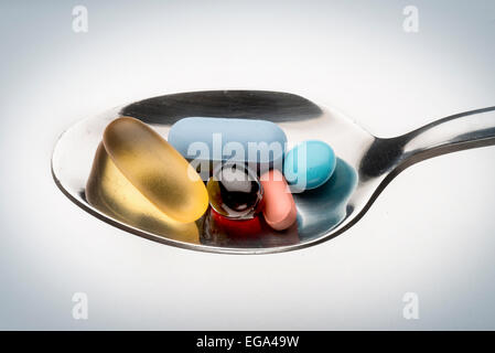 pills in spoon Stock Photo