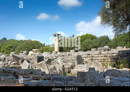 Ruins of the Temple of Zeus, with its single reconstructed Doric column at Ancient Olympia, The Peloponnese, Greece Stock Photo