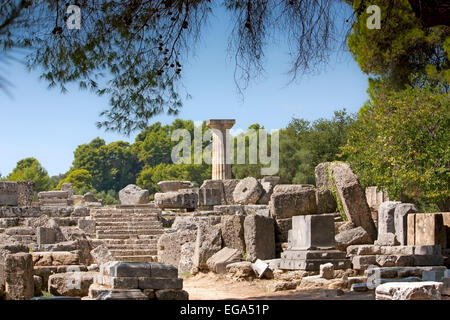 Ruins of the Temple of Zeus, with its single reconstructed Doric column at Ancient Olympia, The Peloponnese, Greece Stock Photo