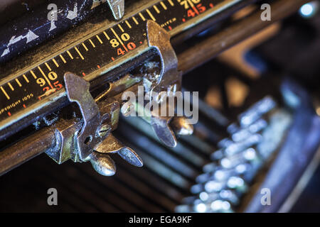 Details of an old typewriter, metering of paper position. Stock Photo