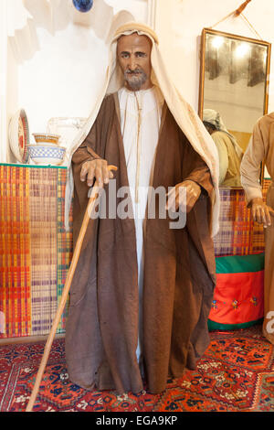 Bedouin man in traditional dress in the museum of Ajman Stock Photo