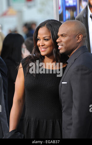 LOS ANGELES, CA - APRIL 7, 2014: Laila Ali, daughter of Muhammed Ali, & husband Curtis Conway at the Los Angeles premiere of 'Draft Day' at the Regency Village Theatre, Westwood. Stock Photo