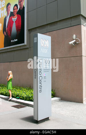 ABC, australian national broadcaster offices in ultimo Sydney,australia with lady outside talking on her mobile phone Stock Photo