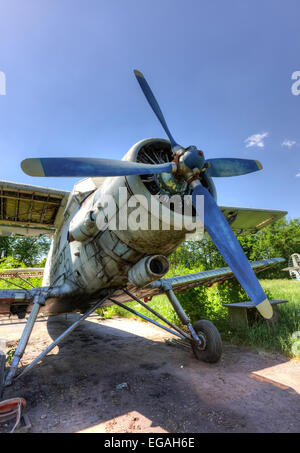 Single-engine biplane at an abandoned aerodrome Stock Photo