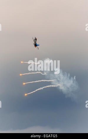 F-16 aircraft deploys anti-missile flares Stock Photo