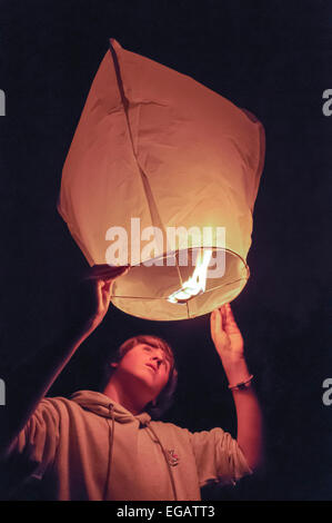 Hands Of Tourist Launching Sky Lantern To The Sky Lampions In The Dark  Stock Photo - Download Image Now - iStock