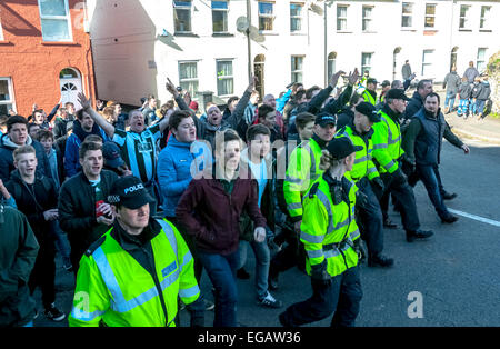 Devon and Cornwall Police escort Plymouth Argyle football fans into St James's Road during the police operation to prevent football violence at the League 2 football match between Exeter City FC and Plymouth Argyle FC on February 21st, 2015 in Exeter, Devon, UK Stock Photo