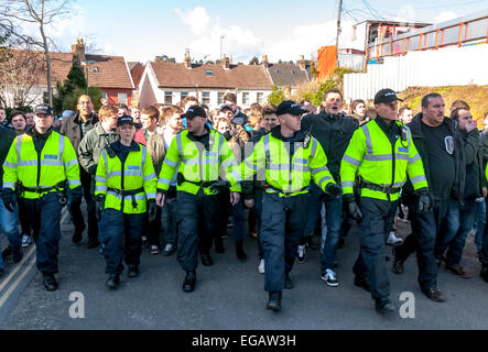 Devon and Cornwall Police escort Plymouth Argyle football fans along St James's Road during the police operation to prevent football violence at the League 2 football match between Exeter City FC and Plymouth Argyle FC on February 21st, 2015 in Exeter, Devon, UK Stock Photo