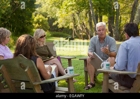 Group of business people meeting outside on corporate retreat Stock Photo