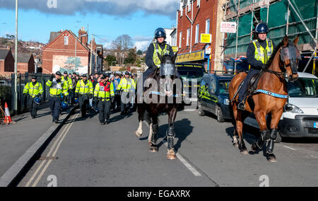 Devon and Cornwall Police escort Plymouth Argyle football fans away from St James's Park during the police operation to prevent football violence at the League 2 football match between Exeter City FC and Plymouth Argyle FC on February 21st, 2015 in Exeter, Devon, UK Stock Photo