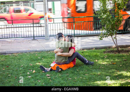 couple embracing in public park, Santiago, Chile Stock Photo