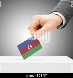 Voting concept - Male inserting flag into ballot box - Azerbaijan Stock Photo