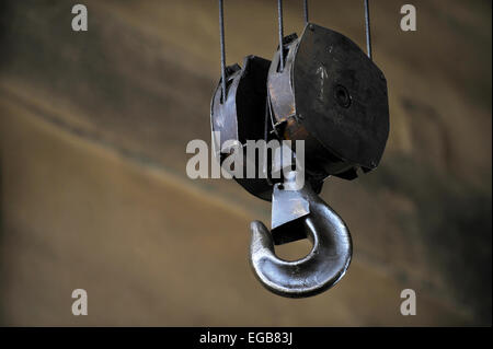 Industrial metal hook detail shot inside a factory Stock Photo