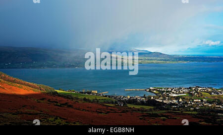 Carlingford Loch and village viewed from Slieve Foy.  The Mourne Mountains are also visible in Northern Ireland across the bay. Stock Photo